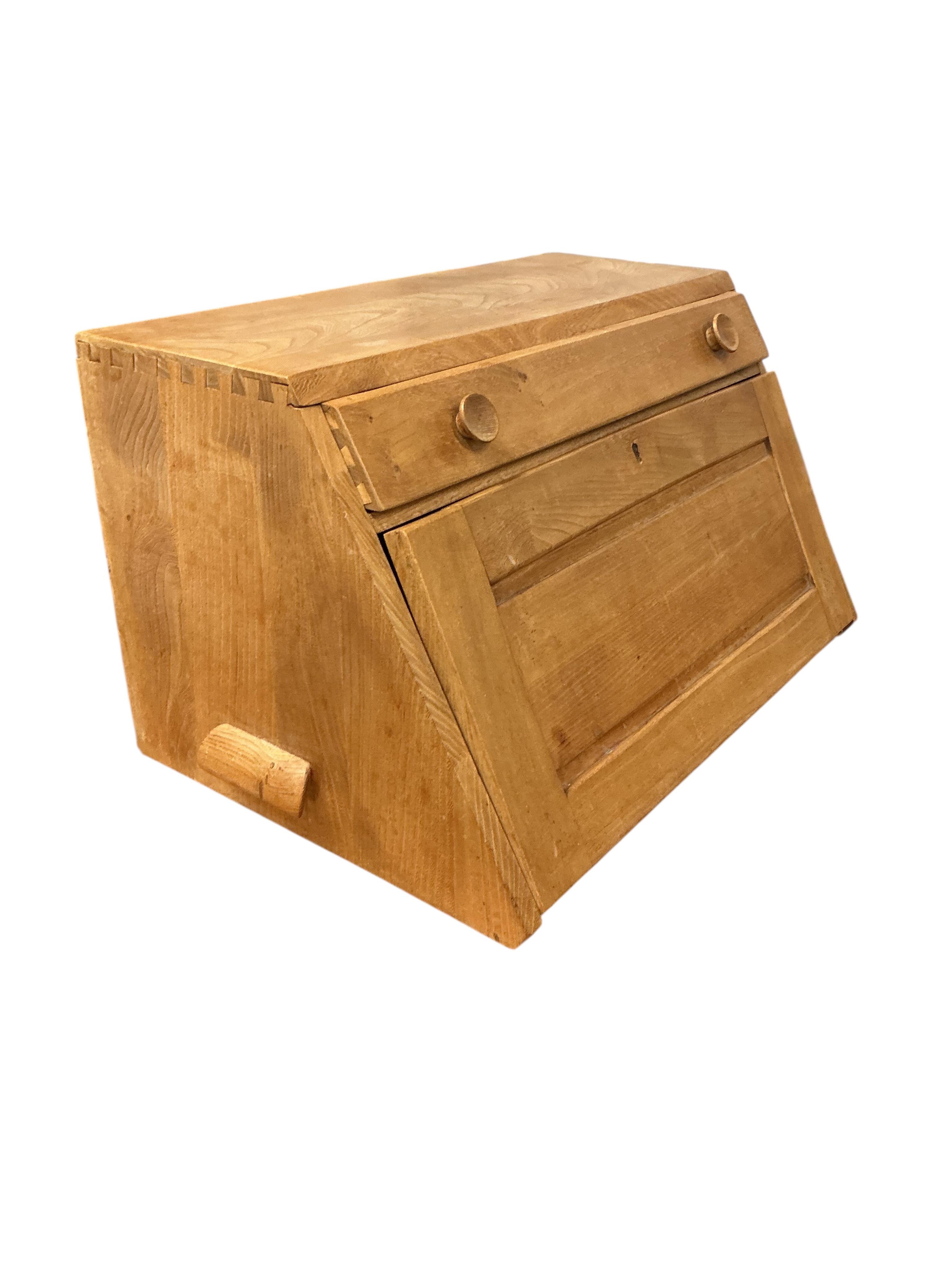 An Ercol elm writing cabinet, width 83cm, depth 42cm, height 37cm